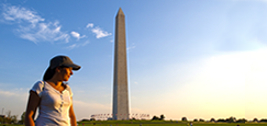 woman standing in front of the Washington monument