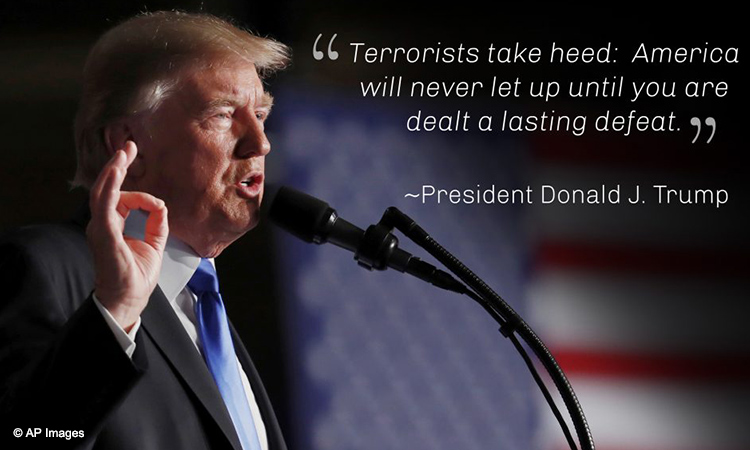 President Trump at podium saying 'Terrorists take heed ...' (© AP Images)