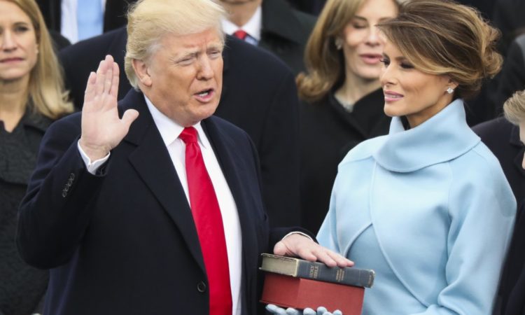Donald Trump is sworn in as the 45th president as Melania Trump holds a bible Trump's mother gave him when he was a boy atop the bible used by President Lincoln at his first inauguration. (Photo: AP Images)