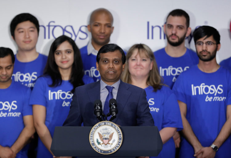 Ravi Kumar, president of Infosys, speaks during a Infosys economic development announcement, Thursday, April 26, 2018, in Indianapolis. The India-based information technology company plans to start a training center in Indianapolis and add 1,000 jobs on top of the 2,000 positions it announced for the city a year ago. (AP Photo/Darron Cummings)